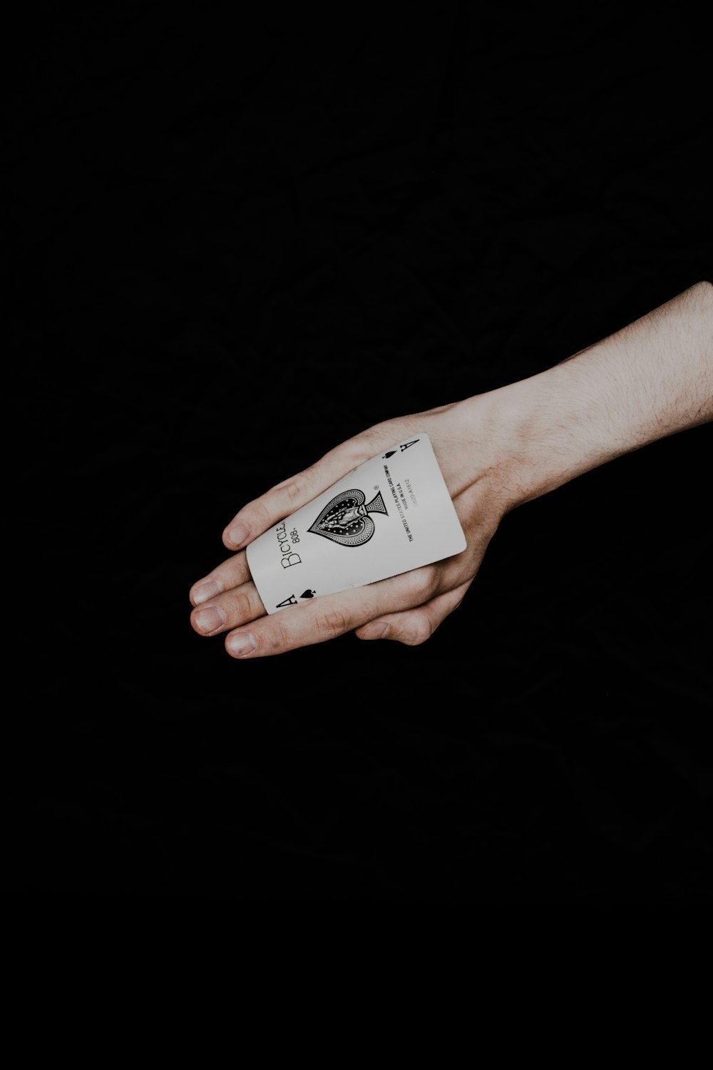 a person holding a card in their hand