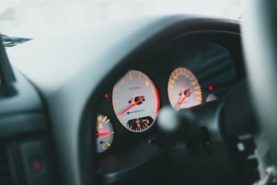 a close up of a speedometer in a car