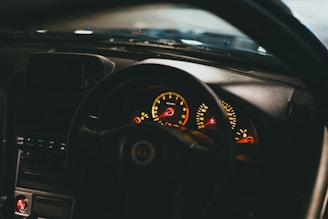 the dashboard of a car with a dash light on