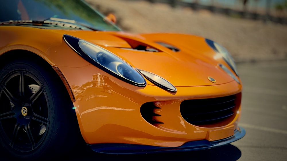 a close up of a sports car on a street