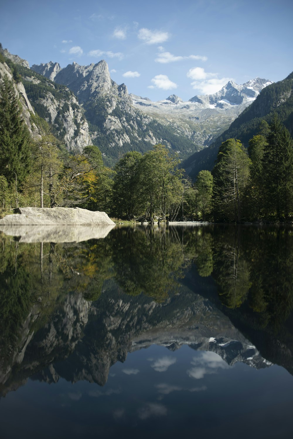 a lake surrounded by mountains and trees