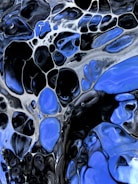 Abstract dark art with electric blue and black tones.