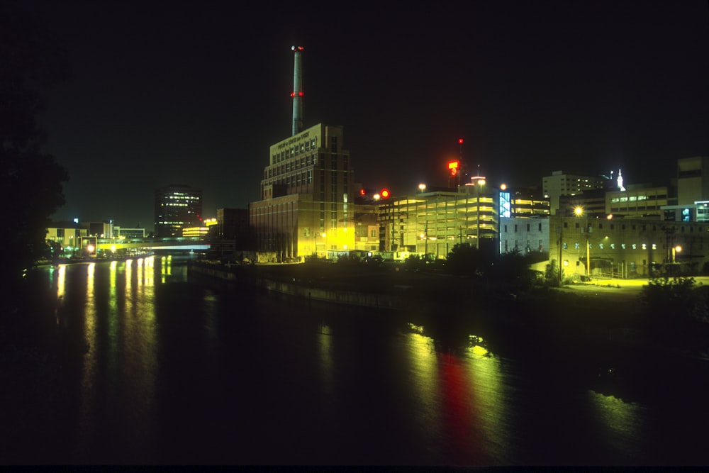 a view of a city at night from across the river