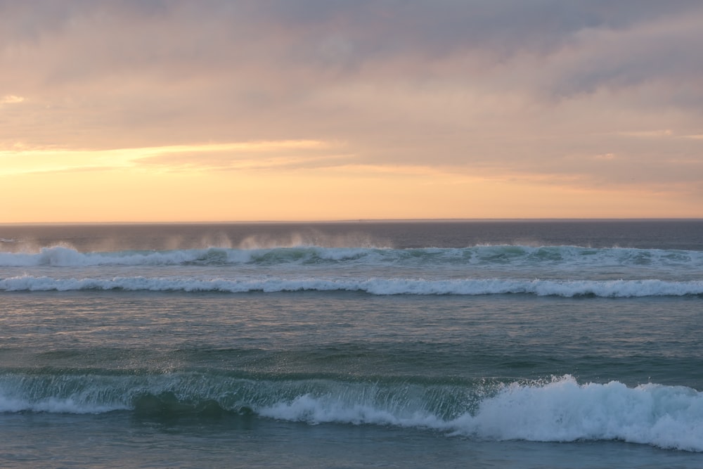 a large body of water with waves coming in to shore