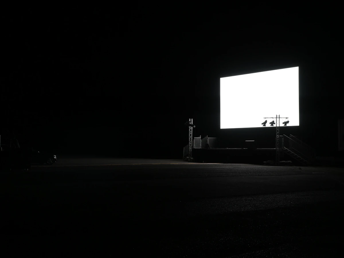 Large IMAG screen relaying a live performance to the audience