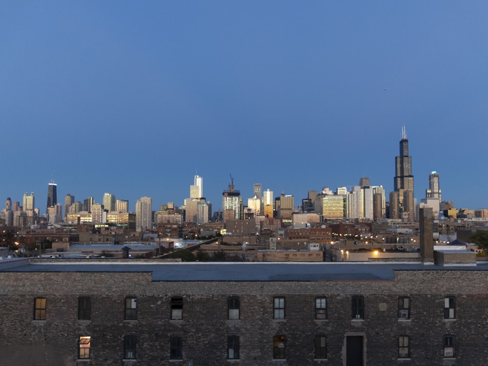 a view of a city skyline from a rooftop