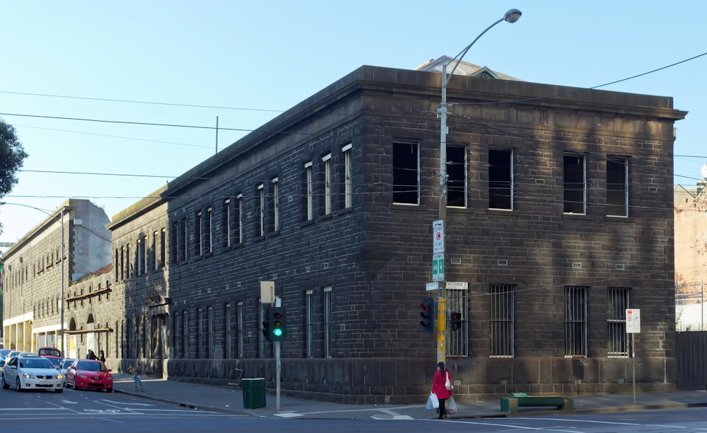 an old brick building on the corner of a street