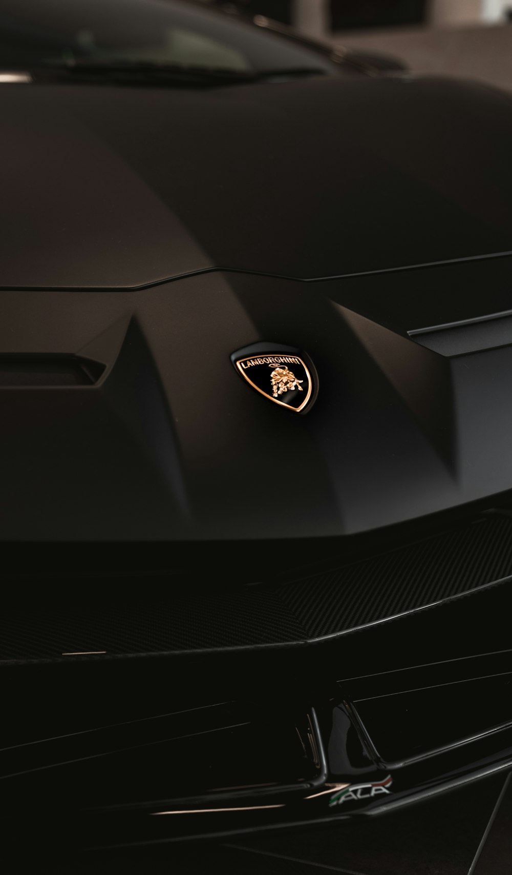 a close up of the front of a black sports car