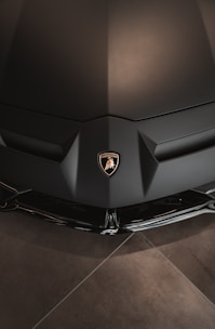 the front end of a black sports car
