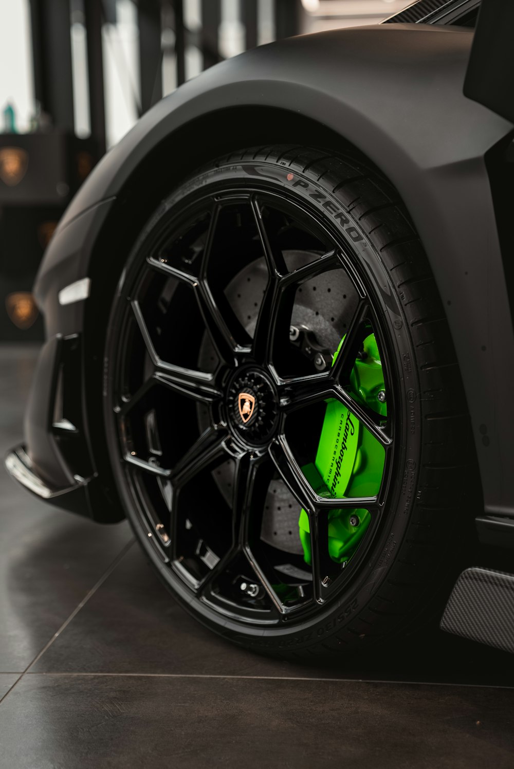 a close up of a black and green sports car