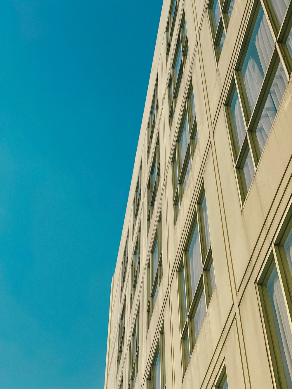 a tall building with a clock on the side of it