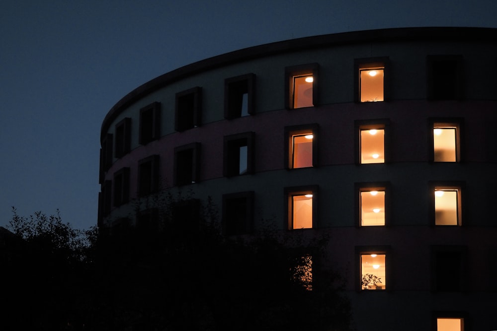 a building with many windows lit up at night