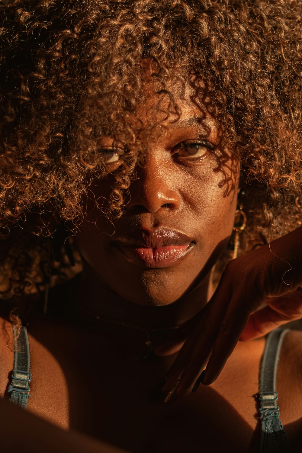 a close up of a person with a large afro