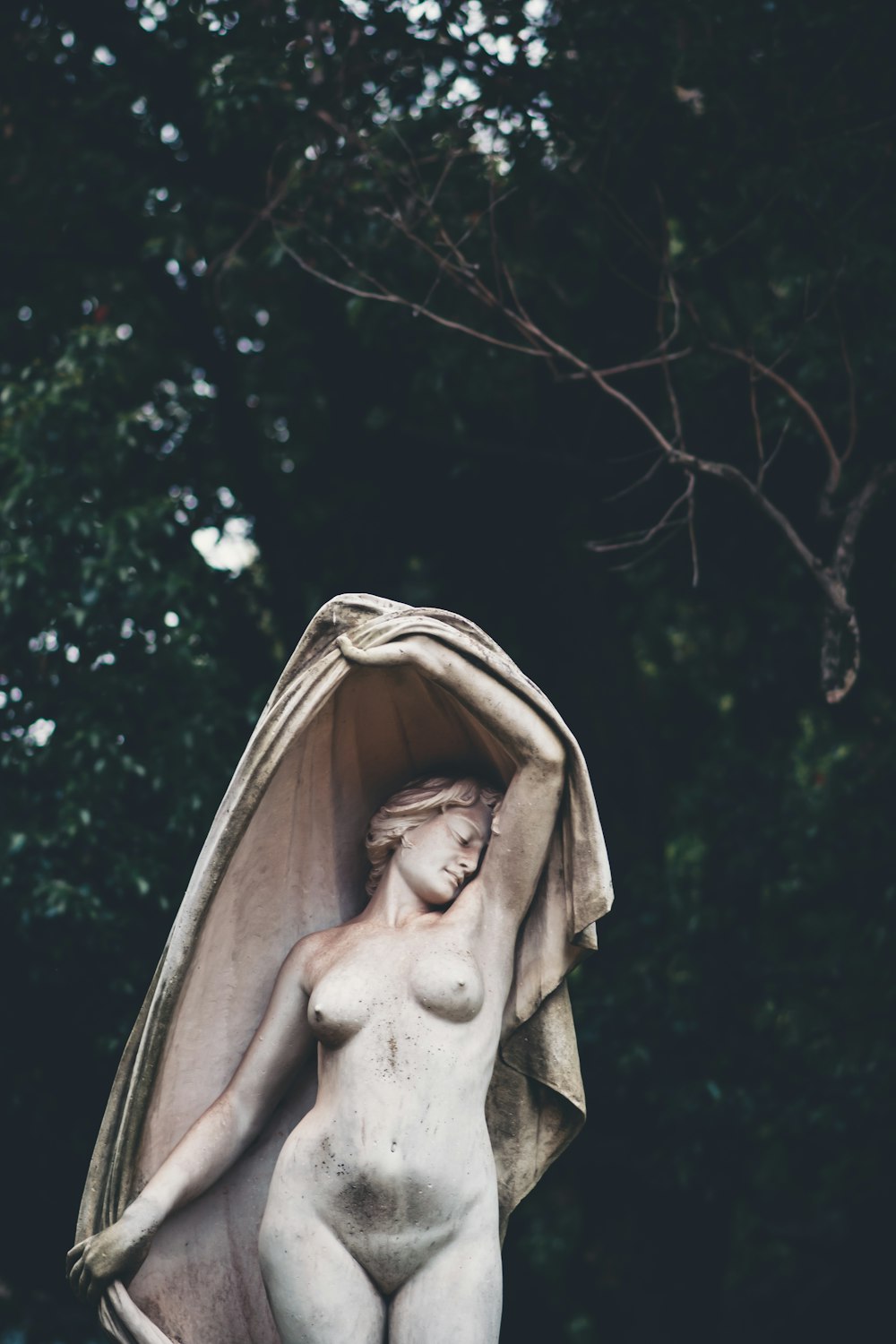 a statue of a woman with a towel draped over her head