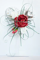 Sophisticated funeral wreath with deep red roses and subtle gold accents