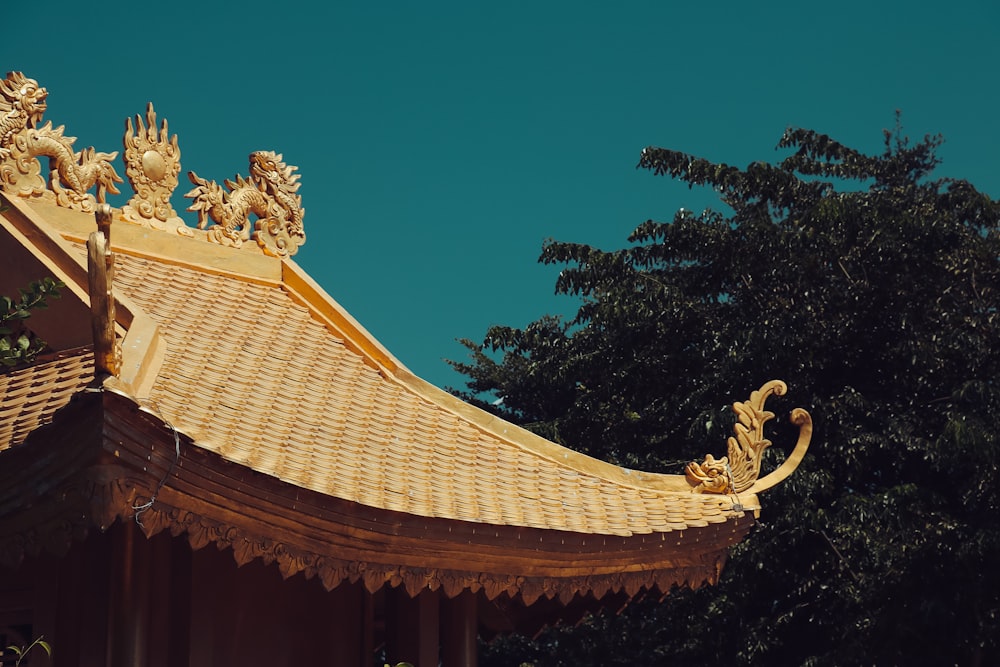 the roof of a building with statues on top of it