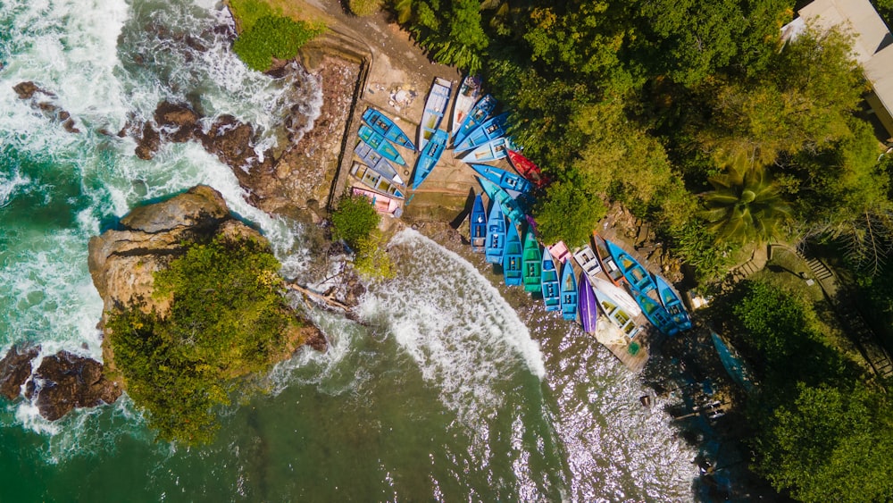 an aerial view of a beach with a bunch of boats