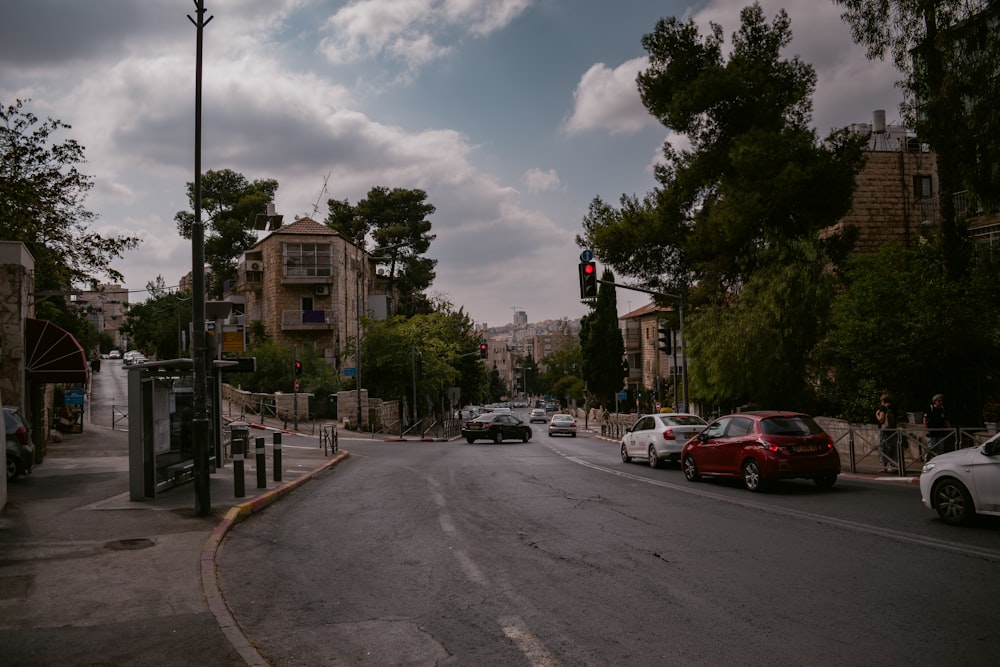 a street filled with lots of traffic next to tall buildings