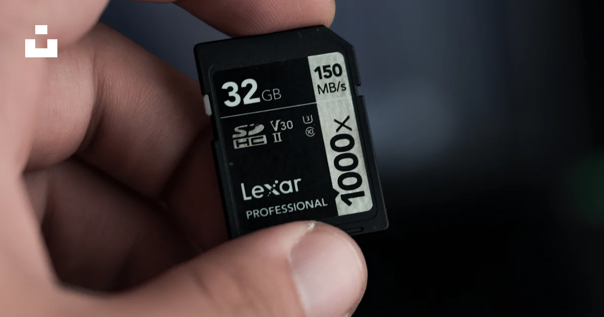 Memory Card Image A hand holding a micro sd memory card photo – Free Memory card Image on ...