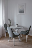 A stylish dining area with compact, elegant furniture fitting perfectly in a small room.