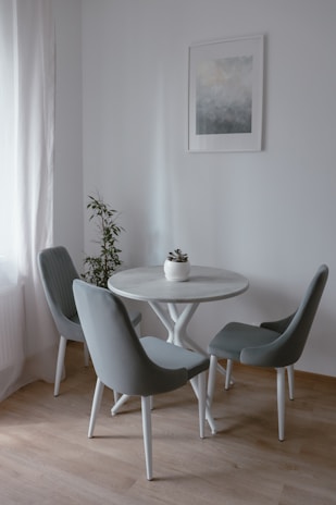 A compact dining area with modular seating and a minimalist table, perfect for small spaces.