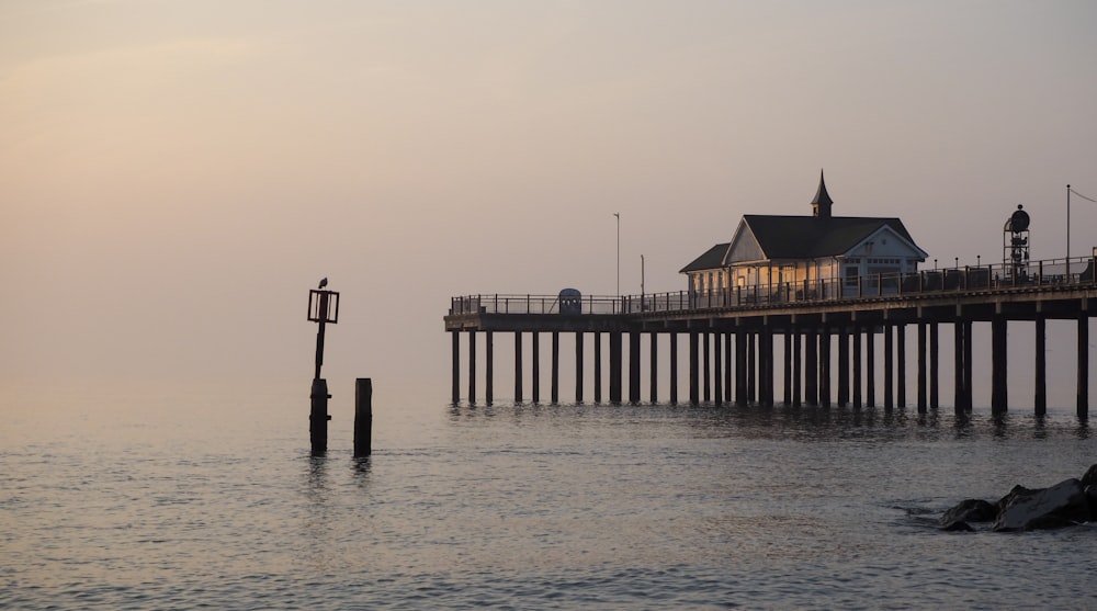 a pier with a house on top of it