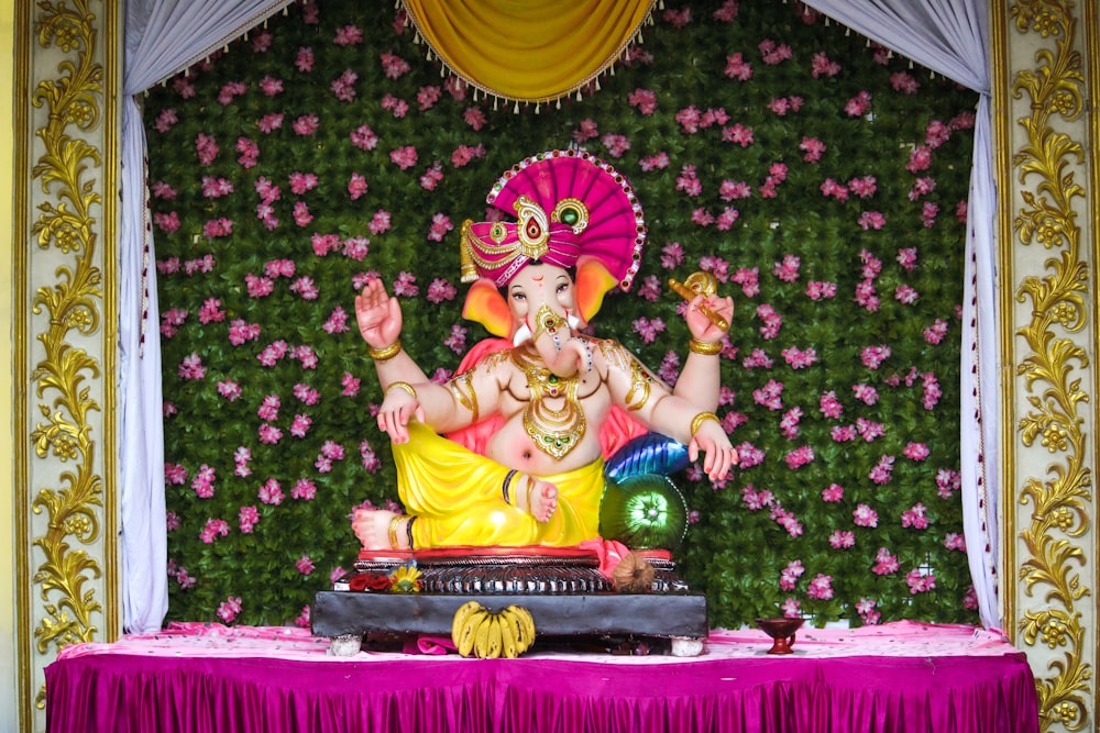 a statue of a hindu god on a stage
