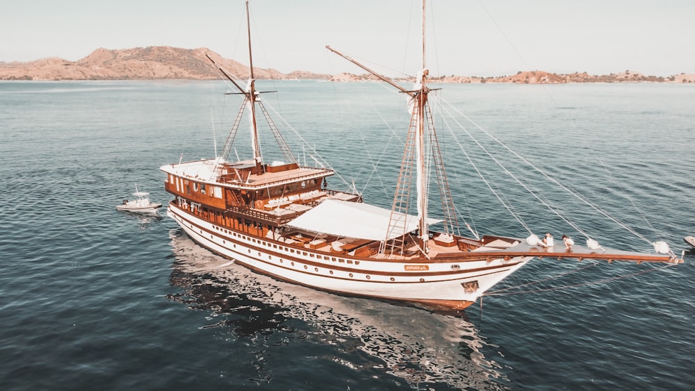 a large boat floating on top of a body of water