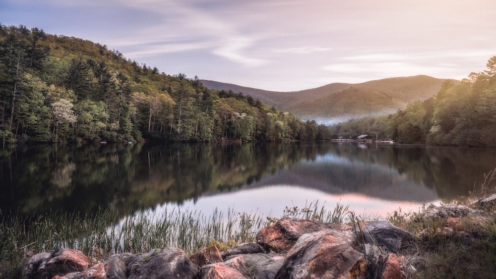 a lake surrounded by trees and rocks