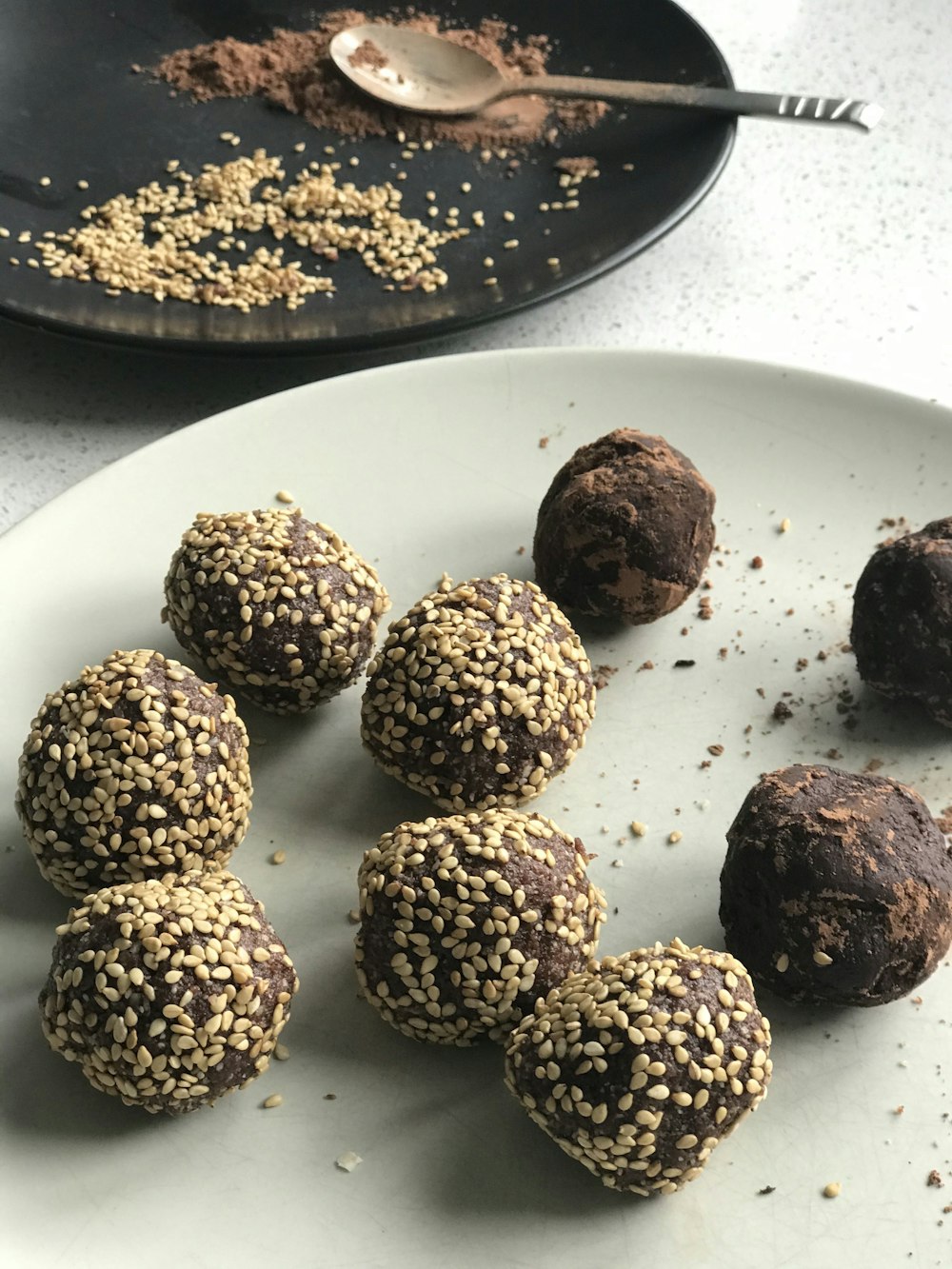 a plate of chocolate truffles on a table