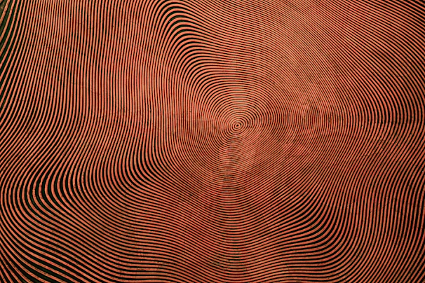a red and black background with wavy lines