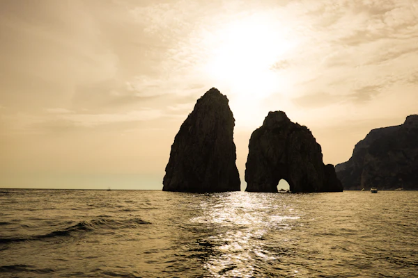 Capri's Faraglioni rock formations in evening light