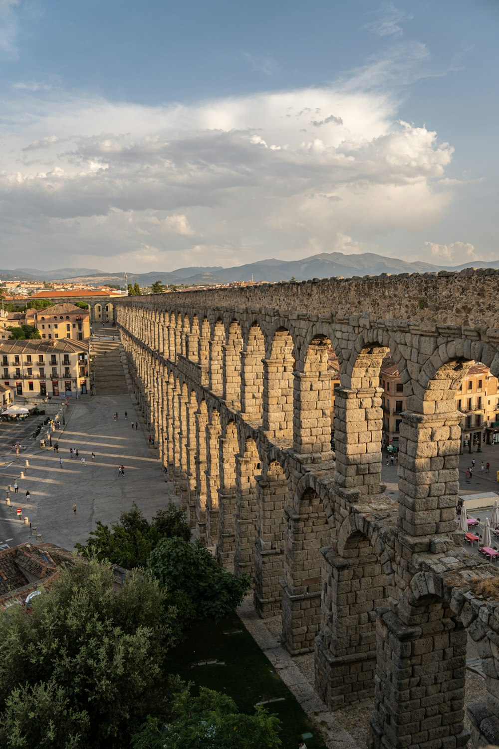 a large stone structure with arches on top of it