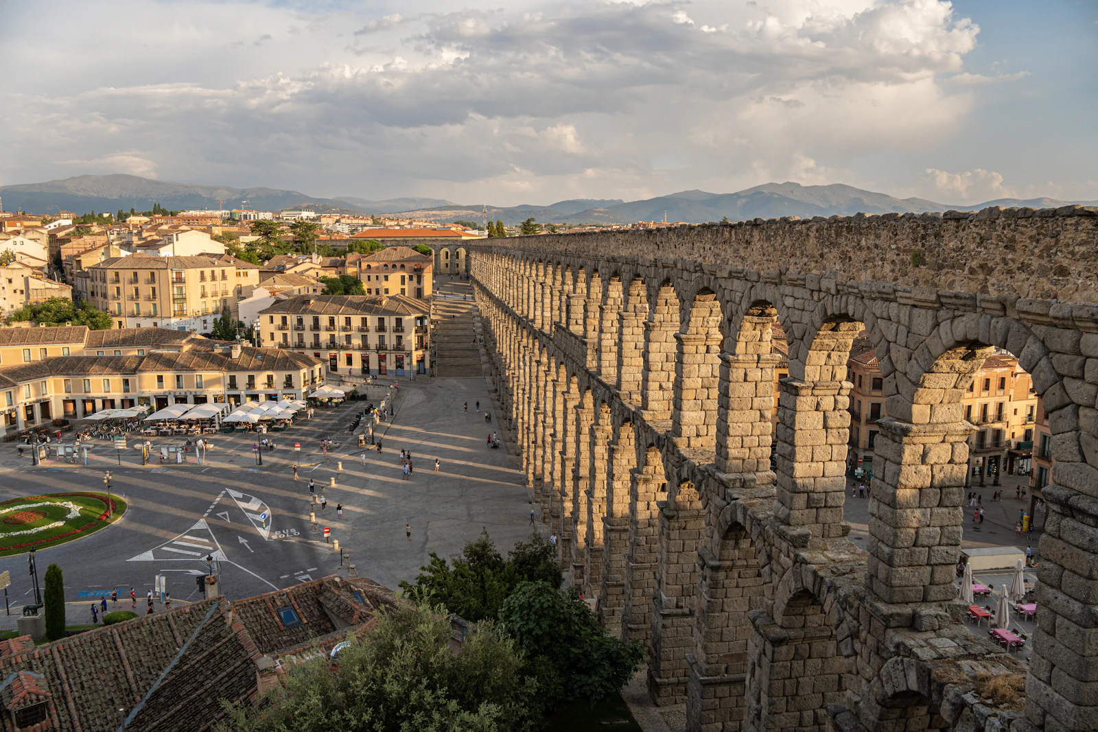 The Roman aqueduct striding across the Plaza del Azoguejo — Segovia, Spain
