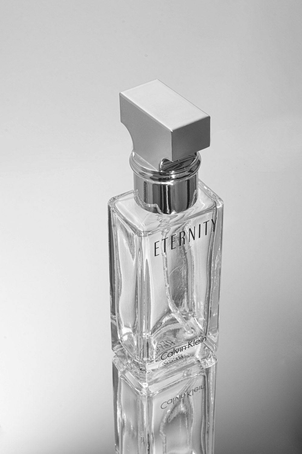 a bottle of perfume sitting on top of a table