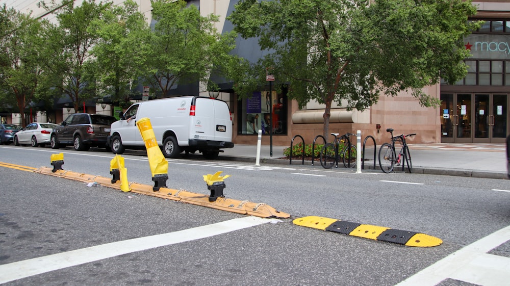 a street that has some yellow barriers on the side of it