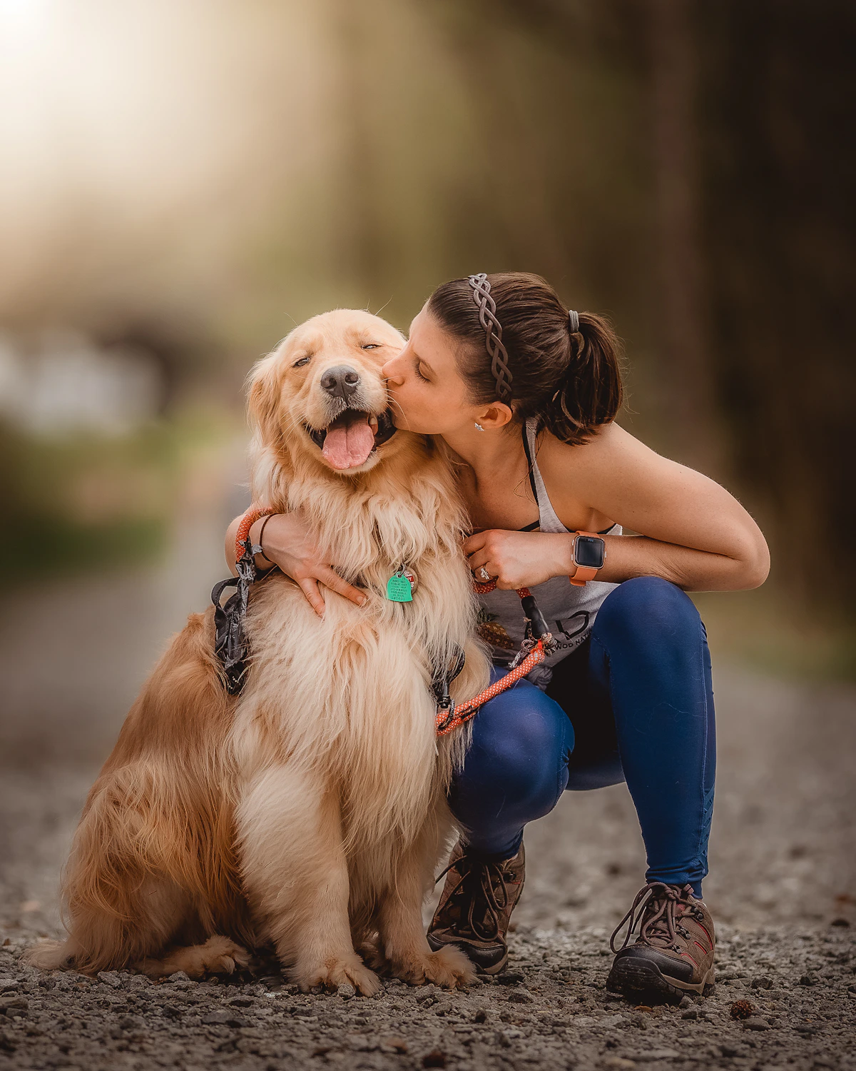Woman kissing her dog during a special everyday moment