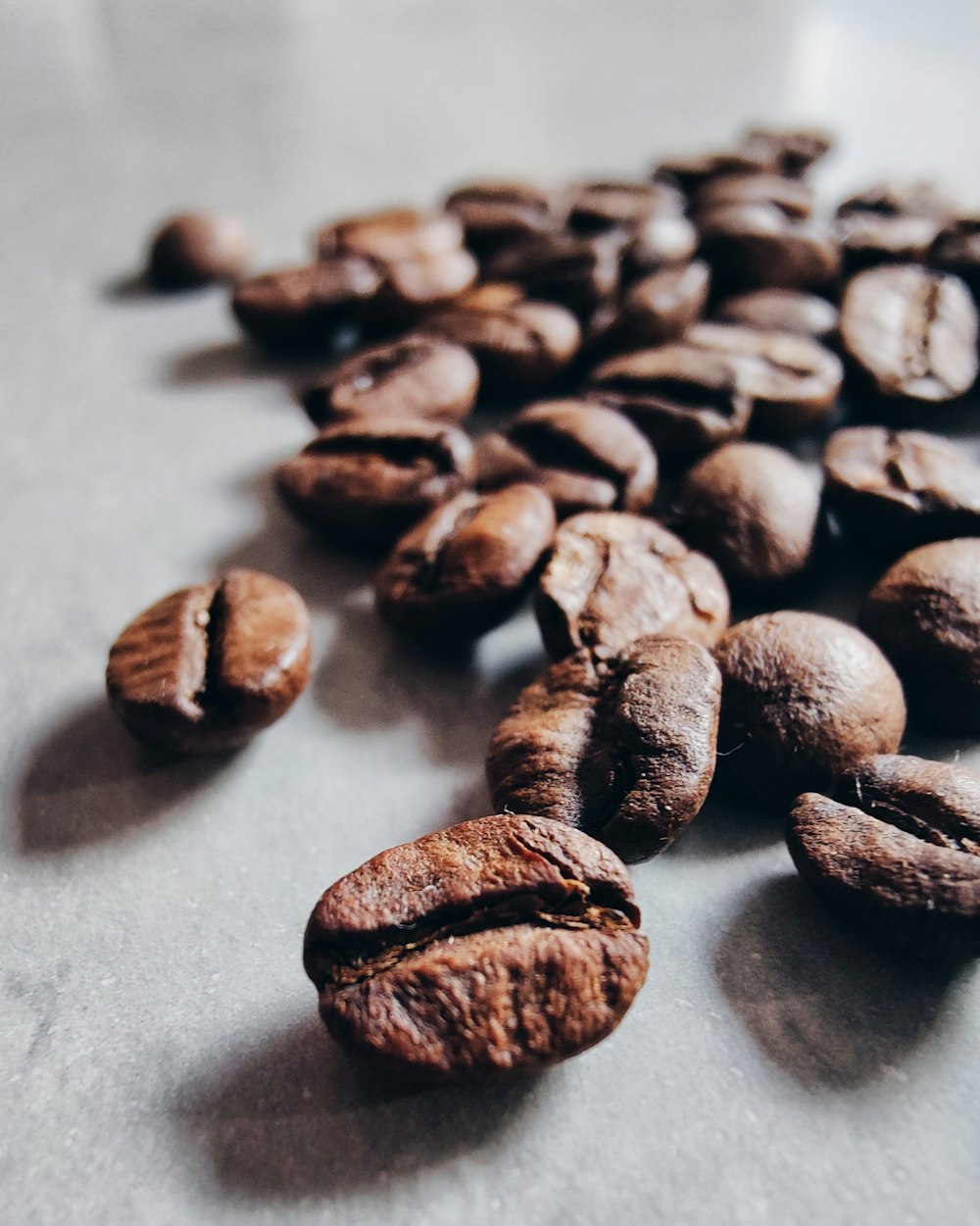 a pile of coffee beans sitting on top of a counter