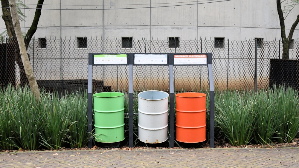 a bunch of barrels that are sitting in the grass