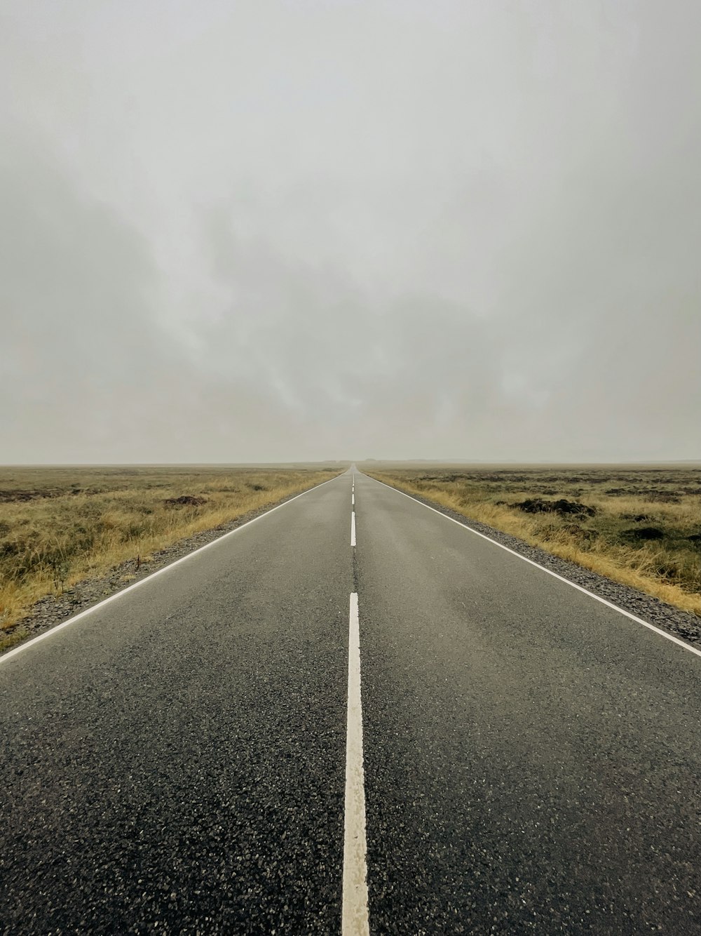 an empty road in the middle of nowhere