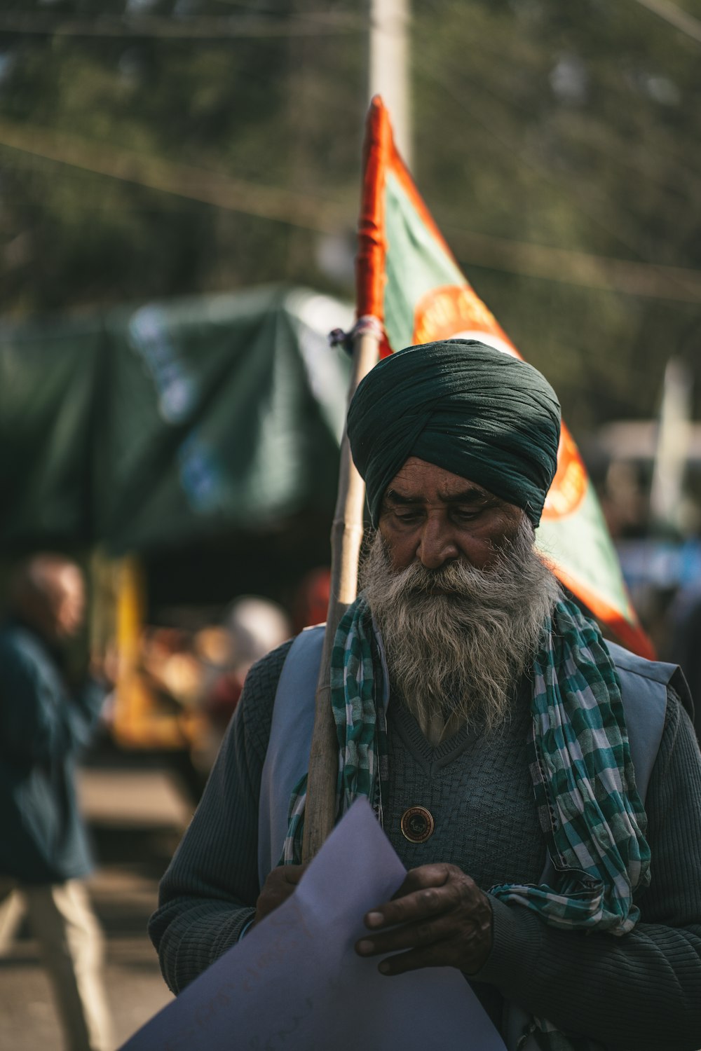 a man with a long beard and a green turban