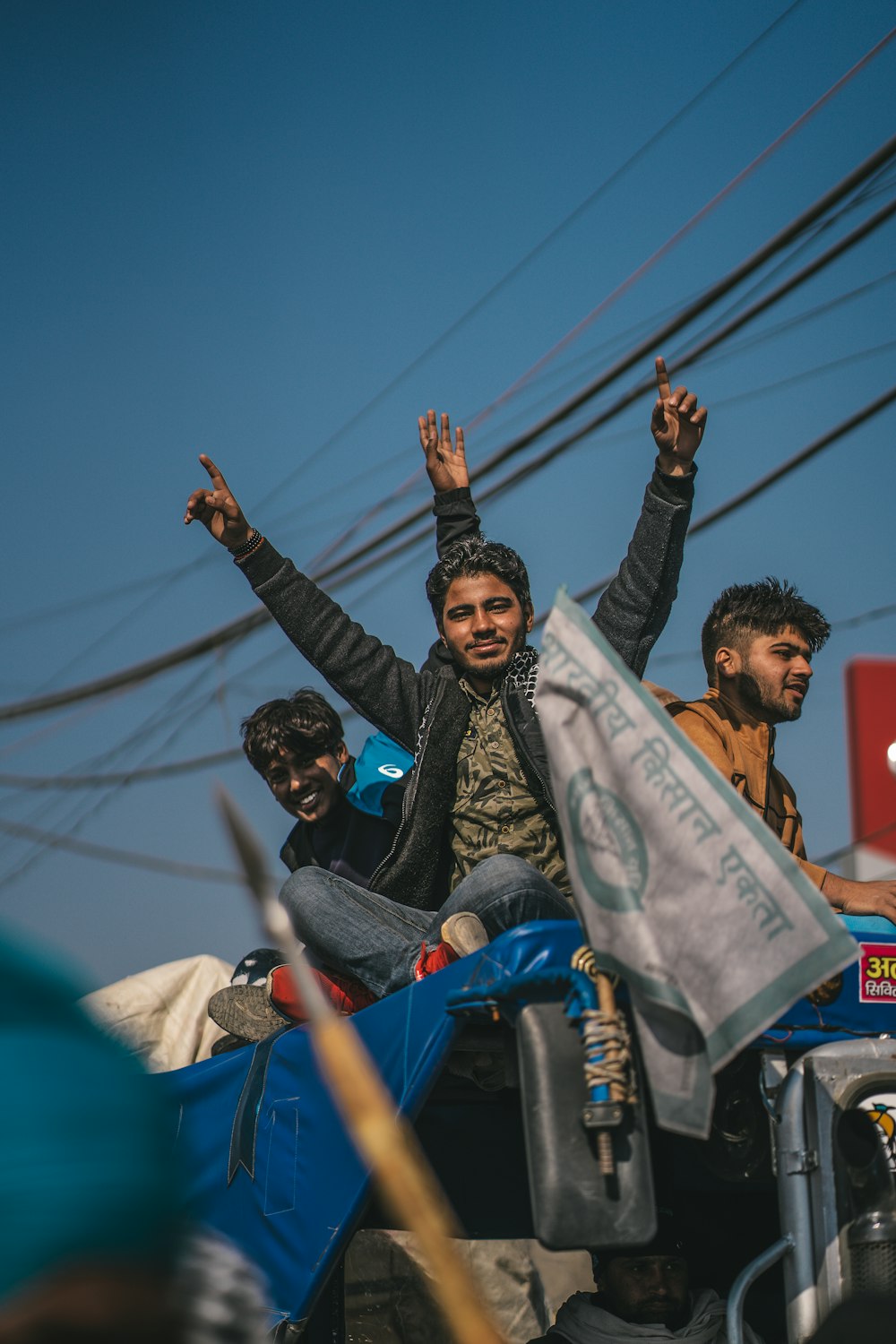 a group of people riding on the back of a motorcycle