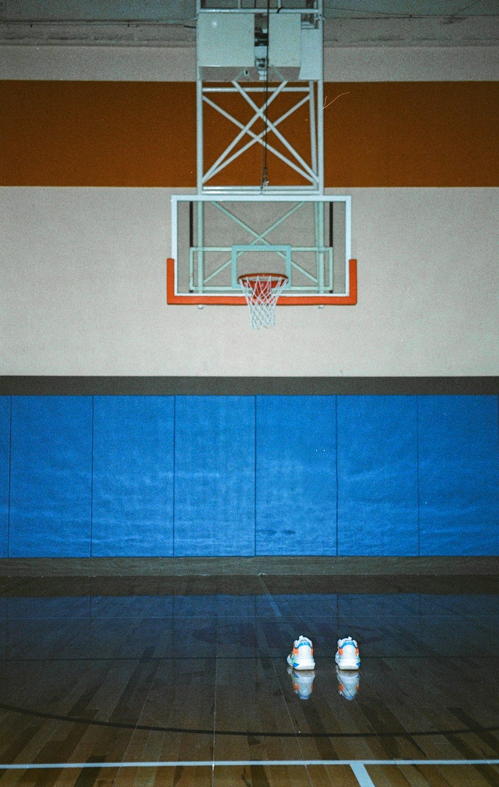 a basketball hoop hangs above a basketball court