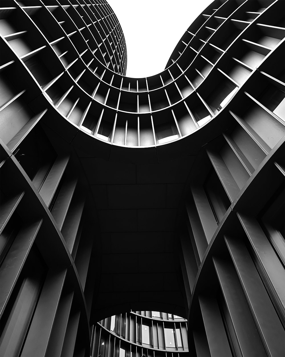 a black and white photo of two tall buildings