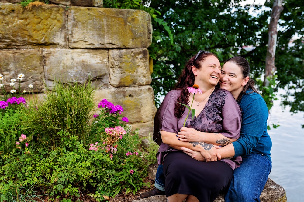 a couple of women sitting next to each other