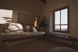 a living room with a couch and a window