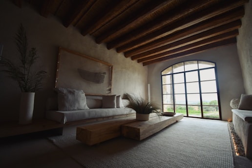 a living room with a couch and a large window