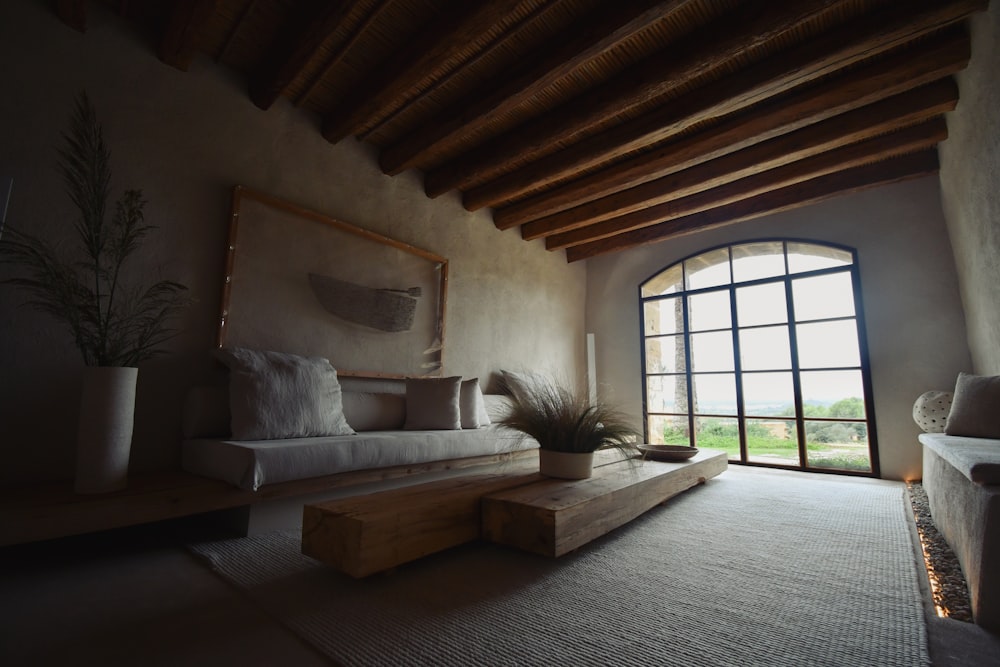 a living room with a couch and a large window