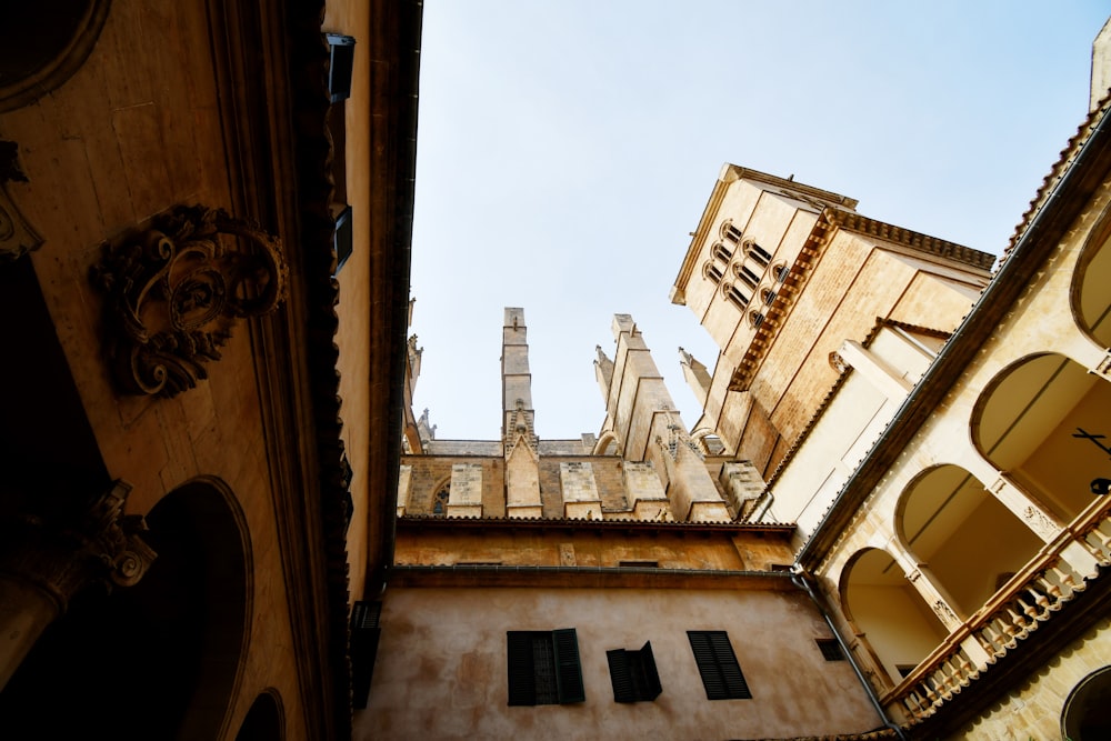 looking up at a tall building with arched windows