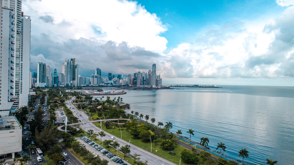 a large body of water with a city in the background